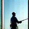 Technician cleaning large windows